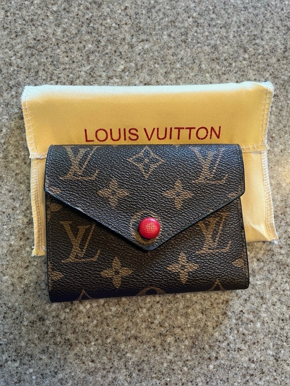 Louis Vuitton Monogram Trifold Wallet in Brown with Red Snap Button